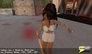 So I decided to check out this new game called Smokin Aces. You get a gun and a HUD to play the game. There are a few safe places like the hotel lobby where you start out and learn about the game. The HUD gives you a bounty list of 5 people to hunt down and kill. It tells you what sim these people are on and the bounty placed on them. I had some fun shooting at Sherry. Dieing is simple. You don't return home, you just fall to the ground. You go back to the hotel, or another revival point, to get ... revived. Kudo's to NBC for actually making something interactive and grid- wide. Looks like they understand the concept of SL and how it can beneifit them. From Dedric Mauriac via blogHUD