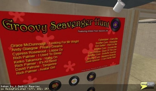 I got another artist signed up for the Groovy Scavenger Hunt today. That makes 16 songs in all that people can hunt for. I created a sign for the scavenger hunt listing all the artists and what songs you can find. I also started working on the actual script to keep track of what items each person has found. Just a few more days and people will be having fun searching for records. I also worked more on my telehub. I've been customizing the Clanis telehub with my own touch. You can now walk inside and look around. From Dedric Mauriac via blogHUD