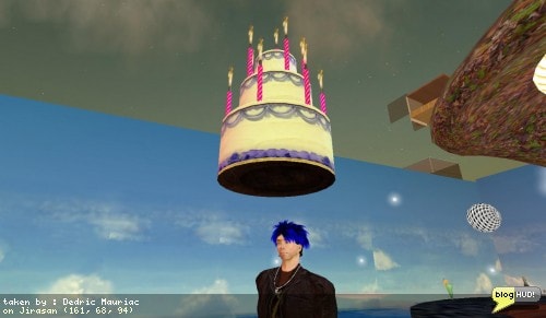 Well, this post is a few hours late. My rezday is November 28, 2005. Someone handed me a rezday cake that let me blow the candles out. After two years, I am still addicted tothe virtual world of second life. I can not shake this habbit. I usually spend over 40 hours a week in this environment. What makes it so addicting? I think the answer is that it is more entertaining then surfing the web all night. I rather enjoy surfing the metaverse instead. From Dedric Mauriac via blogHUD.com