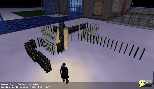 I arrived on New York Island and found myself standing next to some large dominos. The set went around turns, up over a ramp, and then around through to pass under the top set. Temptation got the better of me and I gave into my desires. I bumped into the first domino and watched them all fall down. I kinda felt bad about it afterwards wondering if the owner had a way to reset them back. I was relieved to see them reset on their own after a few moments passed by. I wonderd where I could get a set of these. I saw that they were created by Cory Linden and then searched my inventory on a hunch. I found "Domino" in my inventorys library by Cory Linden. Oh boy! Time to go play. From Dedric Mauriac via blogHUD.com