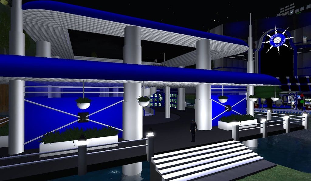 Most of the sim of woodbridge is natural. The technology of my gadget shop usually goes against the whole woodsy theme going on. I really want to find a way to fit in, but still have a tech feel to the place. Unfortunately, blue and white are nto really found in forests much. After redesigning my shop, I made room for a lot of plants and potted planters. It still shouts tech, but in a nature friendly way I believe. The real test will be to see how my wife and mother in-law react when they see the changes. I'm even making it friendly to the customers with using a stairway instead of a teleporter or elevator. I'm separating vendors into single prims you can buy, or touch for information. Posted by Second Life Resident Dedric Mauriac. Visit Woodbridge.