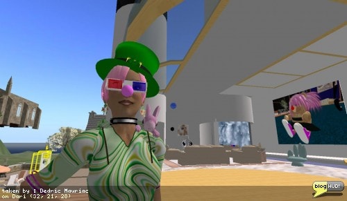 I dropped by and saw stpaulsub Clio for my photoshoot. After I dropped the 100 L$, she gave me a special pink nose. This one has cool sound effects when you click it. stpaulsub got carried away with the photos. She started out taking three, but then I put on my emotional hud so she could get other expressions on my face with the nose. She started taking lots more pictures. I offered to setup a RFL vendor to sell the emotional HUD for a cheap price, but the problem is she would need to be able to take it with her and rez on the fly. To do that, I would have needed to change the permissions of the product. It gets complicated. From Dedric Mauriac via blogHUD.com