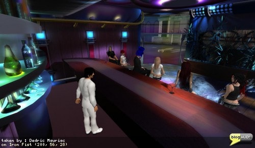 Hamlet Au continues to take a ton of photoes while we talk away and comment about the daily musings of second life. A few of us are wondering what program was used to make the textures. Hamlet is about to play barkeep and pass out a few drinks. We still need to rezz a tip jar for him though. Lienna Jael hopped behind the ar to help Hamlet out. sean Voss claimed that the owner, Sean Augustus, was his evil twin brother. From Dedric Mauriac via blogHUD.com