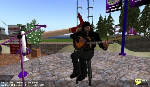 Joaquin Gustav played at Los Arboles Amphitheater for Open Mic Night to help benefit the Relay for Life of Second Life. Rich Desoto says that Joaquin Gustav inspired him to add a section of spanish guitar on one of his new tunes. The music has a romantic and soft melody to it. It makes you enjoy the peaceful things in life, and stops your mind from rushing about. From Dedric Mauriac via blogHUD.com